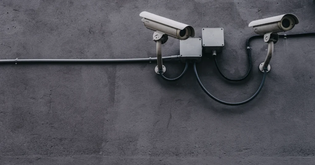 CCTV cameras mounted on a grey wall
