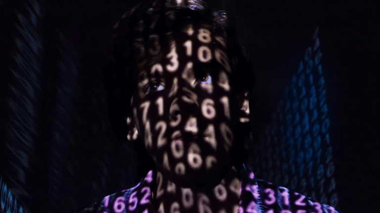 Man in shadows of data